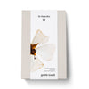 Dr. Hauschka product packaging with a flower design on a white background